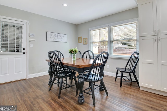 dining area with hardwood / wood-style floors