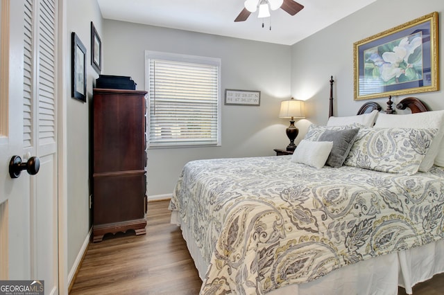 bedroom with hardwood / wood-style flooring and ceiling fan