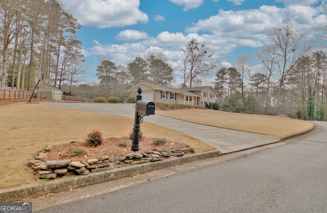 view of front of home featuring a shed