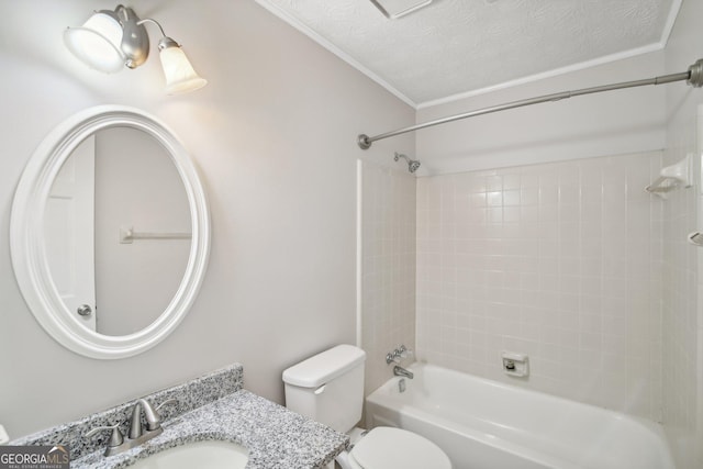 full bathroom with tiled shower / bath combo, vanity, ornamental molding, a textured ceiling, and toilet