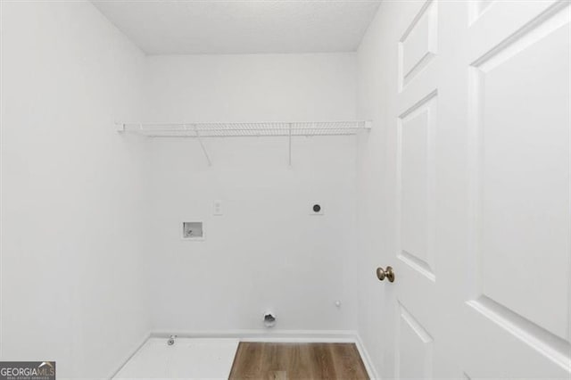 laundry room featuring electric dryer hookup, washer hookup, and hardwood / wood-style flooring