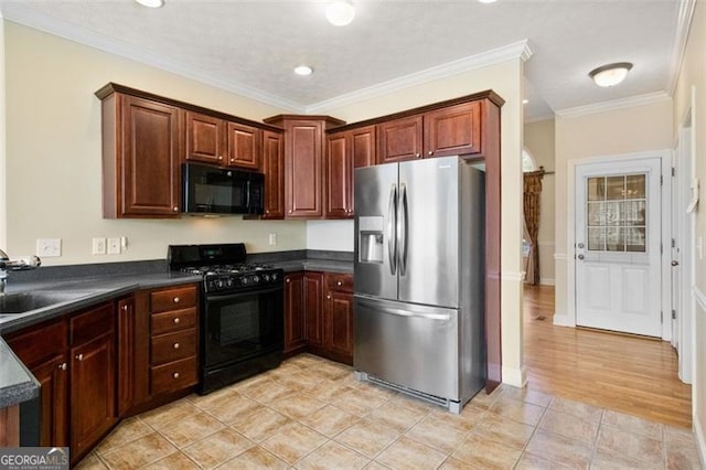 kitchen with crown molding, light tile patterned floors, sink, and black appliances