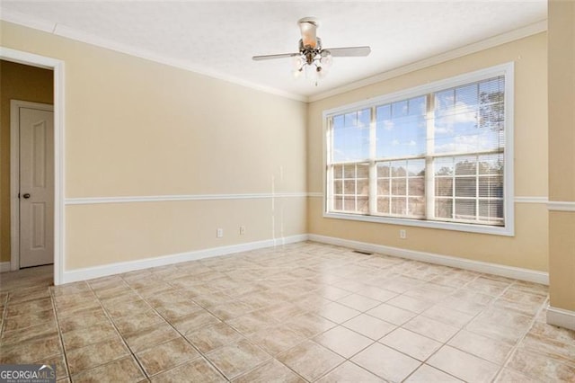 spare room with crown molding, ceiling fan, and light tile patterned floors