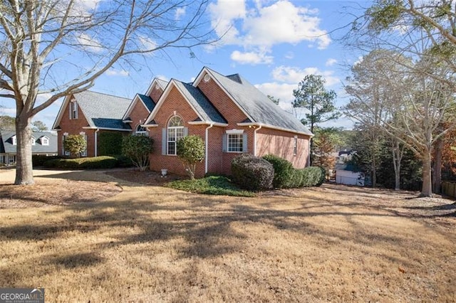 view of property exterior with a lawn