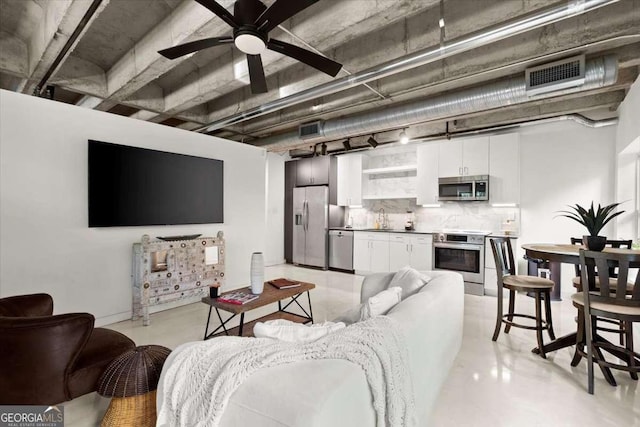 living room with sink and ceiling fan