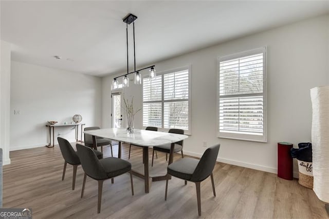 dining area with light wood-type flooring