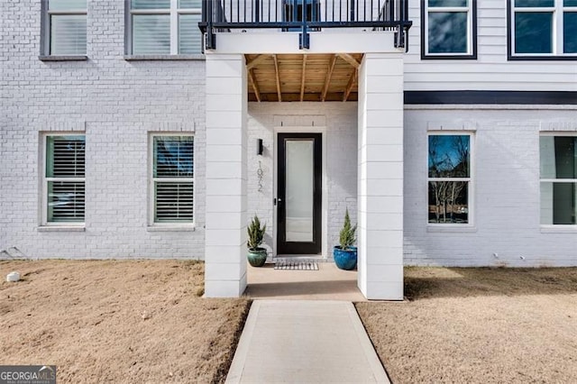 entrance to property featuring a balcony