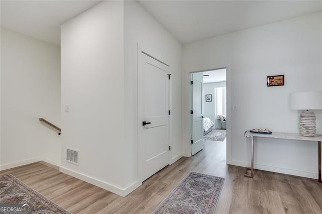 hall with light hardwood / wood-style flooring