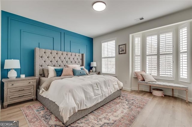 bedroom with light hardwood / wood-style flooring