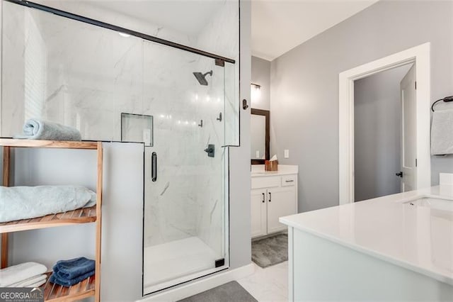 bathroom with vanity and a shower with shower door