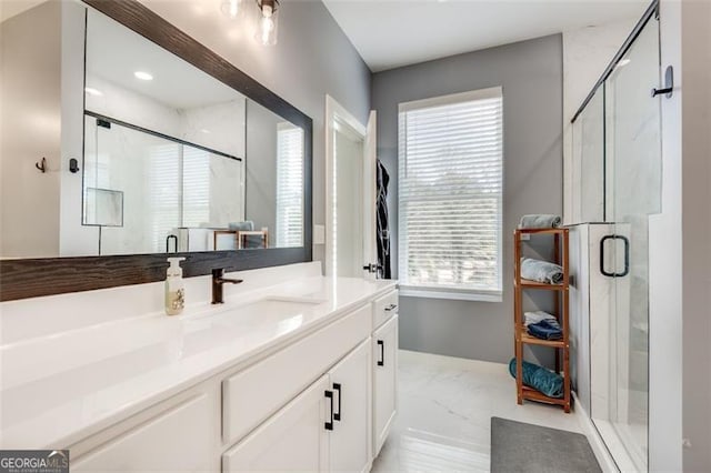 bathroom featuring vanity and walk in shower