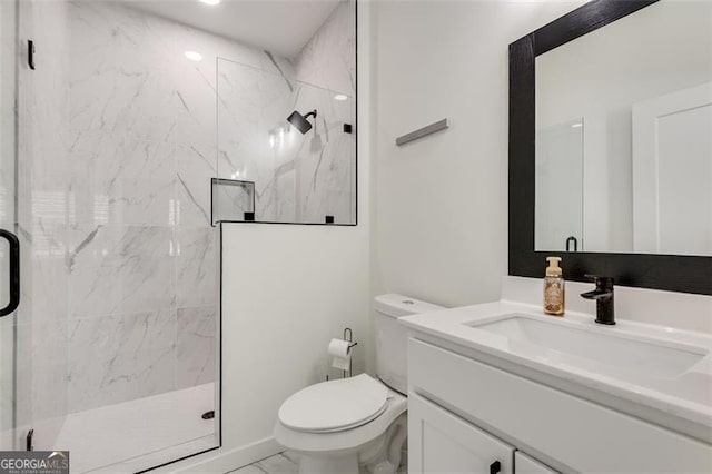 bathroom with vanity, toilet, and an enclosed shower