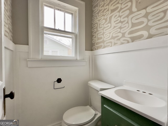 bathroom with vanity and toilet