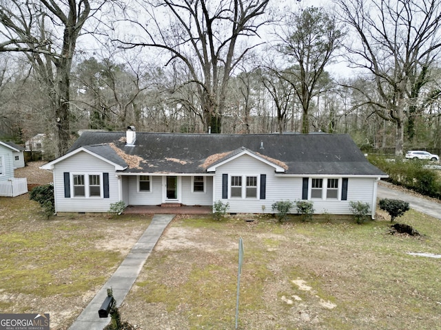 ranch-style house with a front lawn