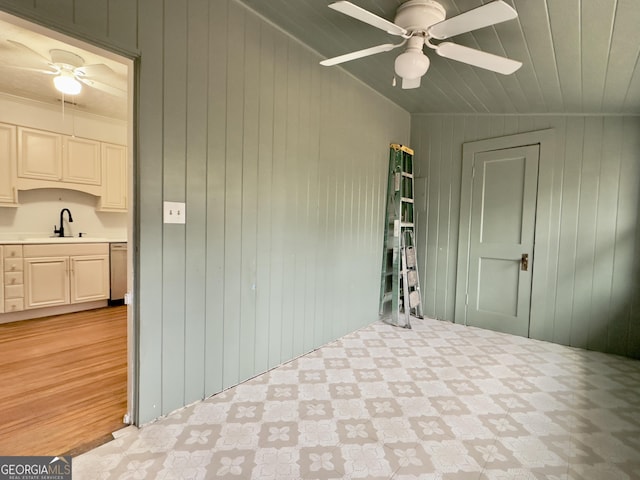 interior space with ceiling fan, area for grilling, and sink