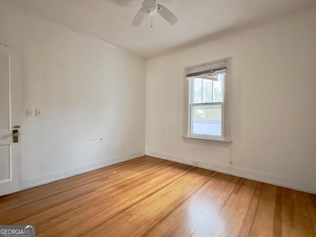 empty room with wood-type flooring and ceiling fan