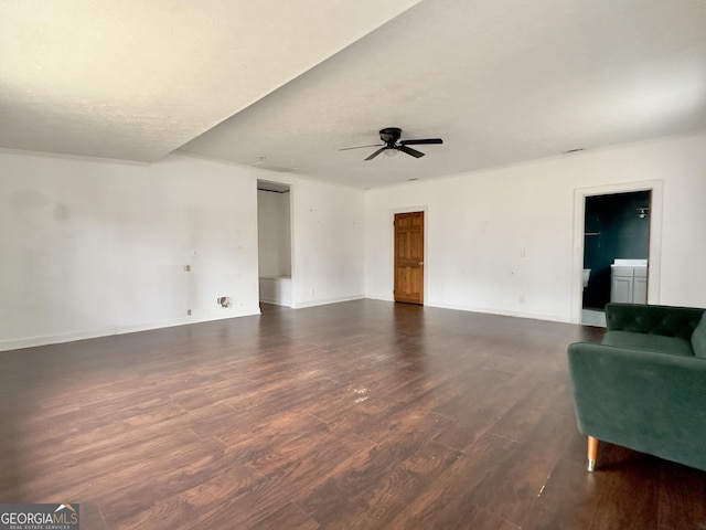 living room with dark hardwood / wood-style flooring and ceiling fan