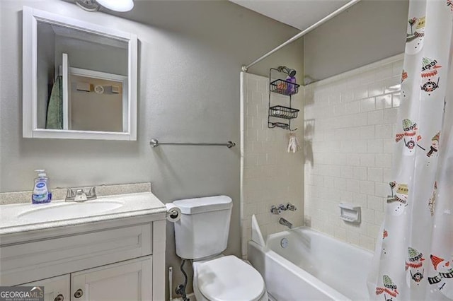 full bathroom featuring shower / tub combo with curtain, vanity, and toilet