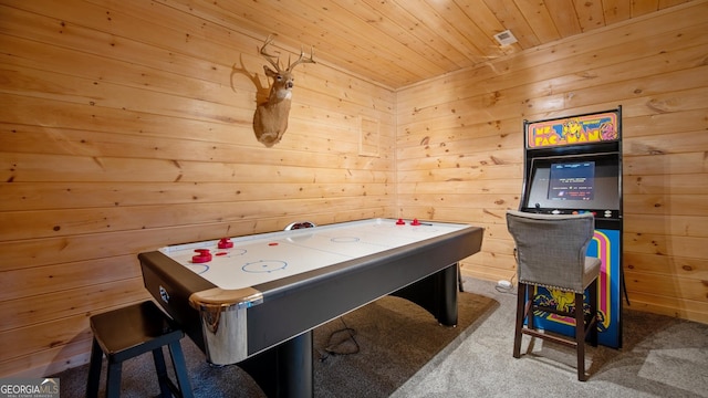 game room featuring carpet floors, wooden walls, and wood ceiling