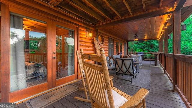 deck featuring french doors and ceiling fan