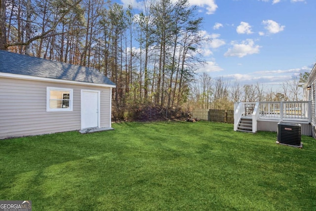 view of yard with cooling unit and a wooden deck