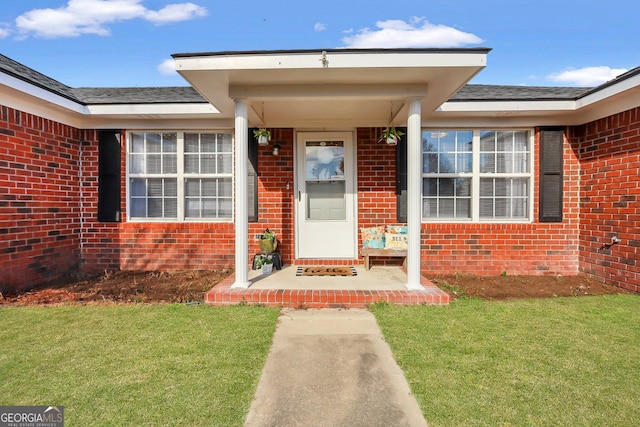 entrance to property with a yard