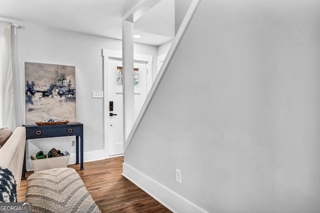 entryway with hardwood / wood-style floors