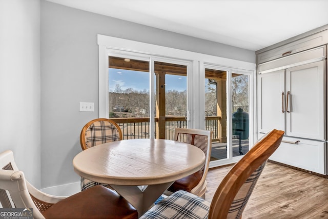 dining area with light hardwood / wood-style floors