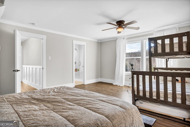 bedroom featuring crown molding, ceiling fan, wood-type flooring, and ensuite bathroom