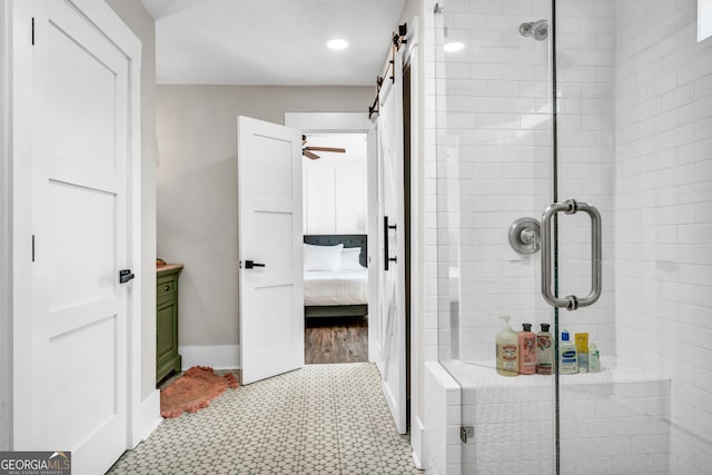 bathroom featuring an enclosed shower and vanity