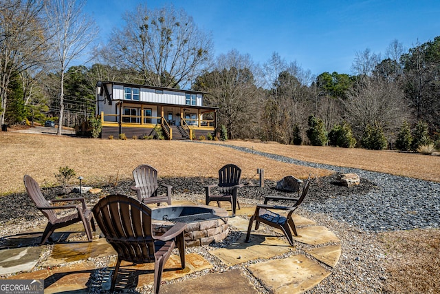 view of patio / terrace with an outdoor fire pit