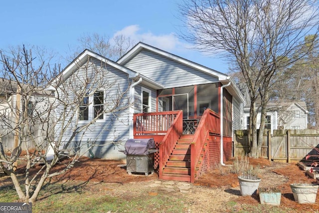 view of front of home featuring a sunroom