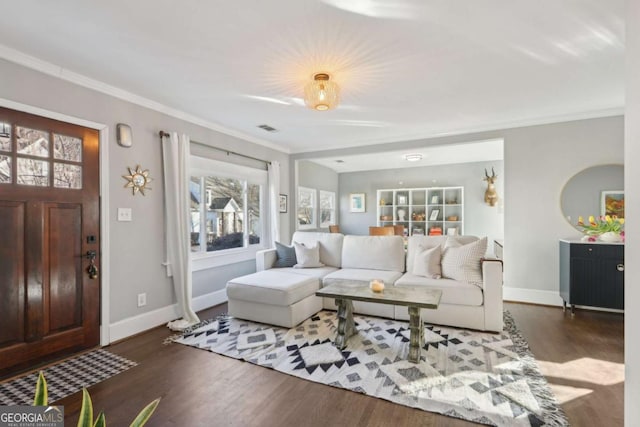 living room featuring crown molding and dark hardwood / wood-style flooring