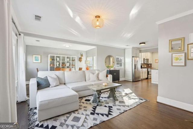 living room featuring hardwood / wood-style floors and ornamental molding