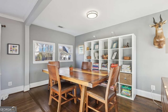 dining space featuring dark hardwood / wood-style flooring