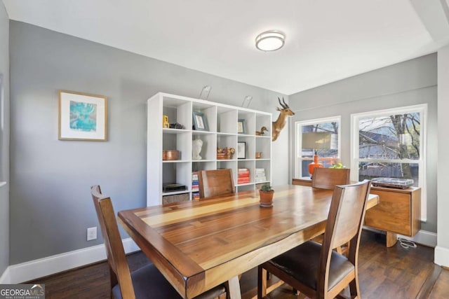 dining area with dark wood-type flooring