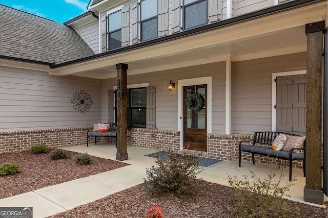 doorway to property with a porch