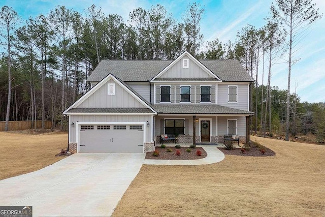 craftsman inspired home with a porch and a front yard