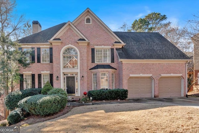 view of front of property with a garage