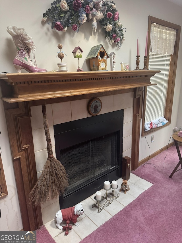 room details with carpet and a fireplace