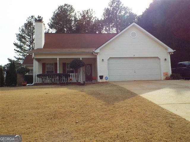 view of front facade featuring a porch, a garage, and a front lawn