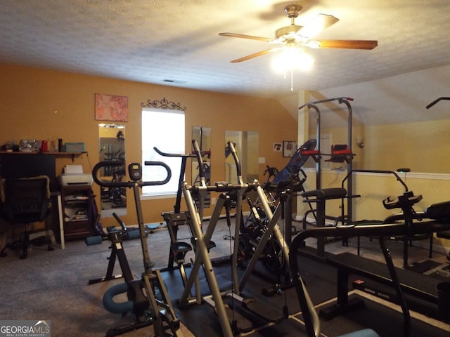 exercise room featuring ceiling fan and a textured ceiling