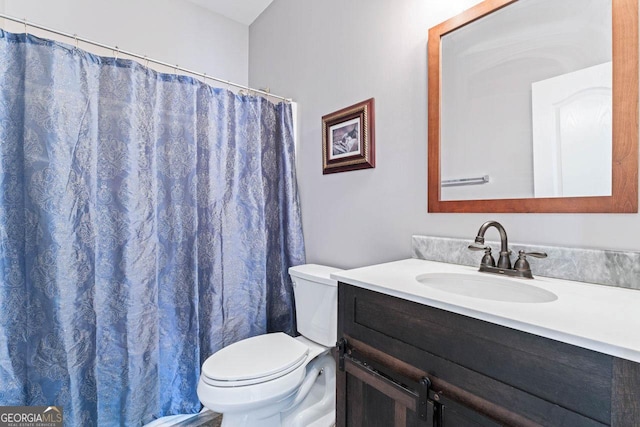 bathroom with vanity and toilet