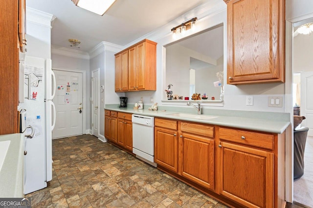 kitchen featuring crown molding, sink, and white appliances