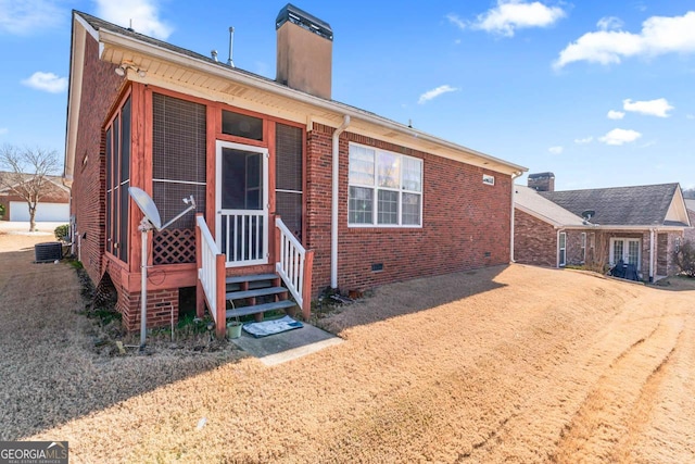 back of property featuring central AC