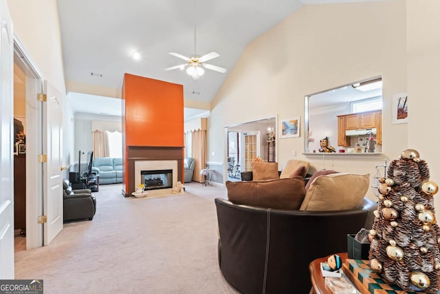 carpeted living room featuring high vaulted ceiling and ceiling fan