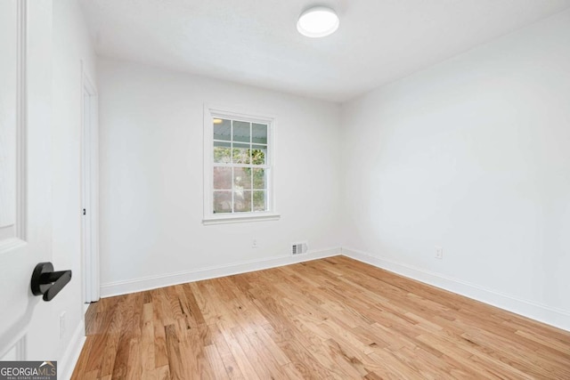 unfurnished room with light hardwood / wood-style flooring