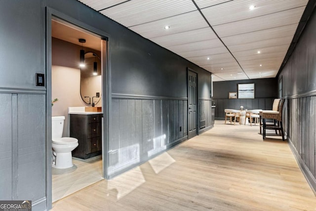 corridor featuring light hardwood / wood-style floors