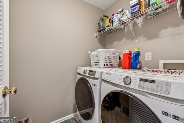 clothes washing area featuring separate washer and dryer