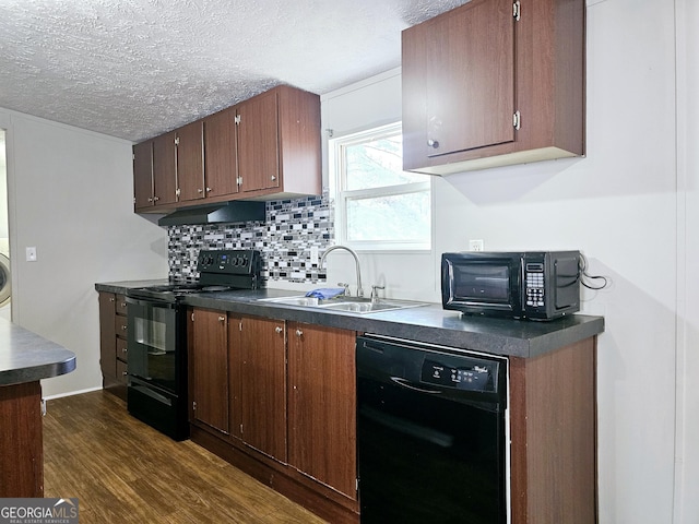 kitchen with tasteful backsplash, sink, dark hardwood / wood-style flooring, black appliances, and a textured ceiling